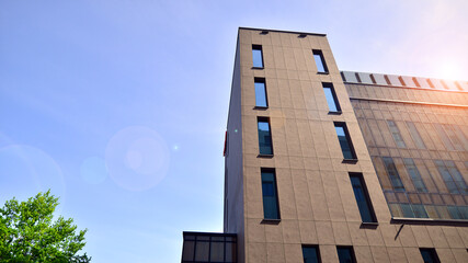 Obraz premium Modern office building detail. Perspective view of geometric angular concrete windows on the facade of a modernist brutalist style building. 