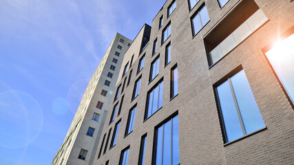 Modern office building detail. Perspective view of geometric angular concrete windows on the facade of a modernist brutalist style building. 