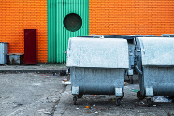 Metallic trash container dumpsters on the street