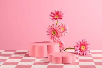 Frontal shot photo for advertise product which made from natural material such as gerbera daisy, empty pedestal in pink color, over light pink texture. Copy space for adding text