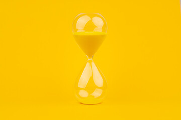 Hourglass on yellow background, time and countdown time limit for urgent work to meet deadlines and...