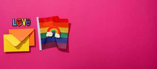 LGBT parade concept, holiday symbols on pink background.
