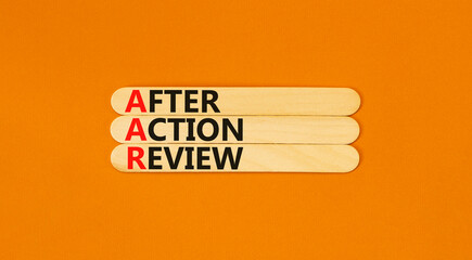 AAR After action review symbol. Concept words AAR After action review on beautiful wooden stick....