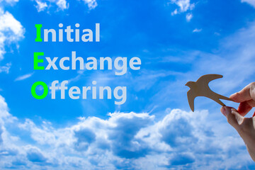 IEO initial exchange offering symbol. Concept words IEO initial exchange offering on beautiful blue...