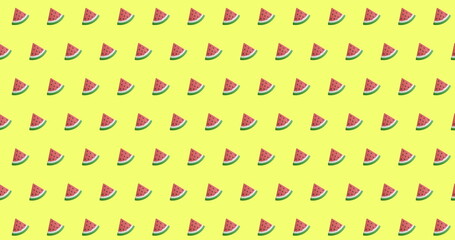 Multiple watermelon slices are repeating on bright yellow background