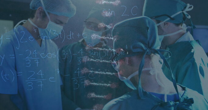 Image of rotating dna over caucasian female and male surgeons in face masks during operation