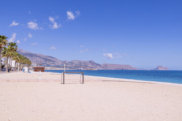 Photo of the beautiful beach in Albir, Altea, Alicante in Spain showing soccer football nets on the beach front by the ocean on the beach known as Playa de Cap Blanch