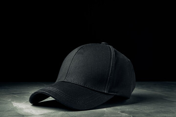 Baseball cap against black background studio shot