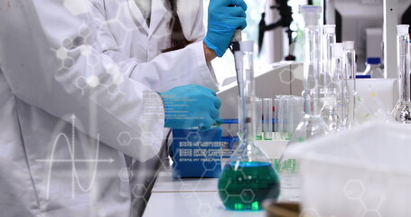 Mid section of scientists laboratory mathematical equations against mathematical equations image lab