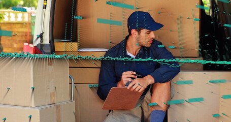 Image of financial data processing and globe over caucasian delivery man by boxes