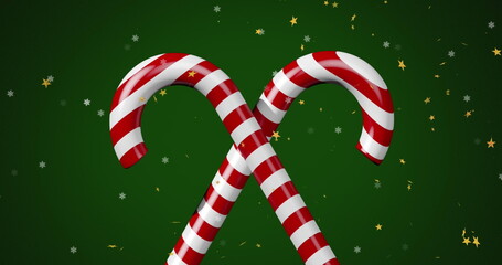 Image of stars over candy canes on green backrgound