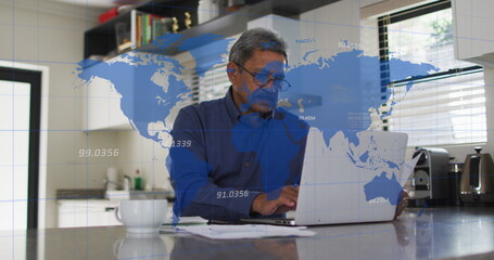 Image of world map with data processing over senior biracial man using laptop