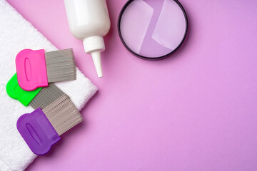 Anti lice combs and towel on pink background