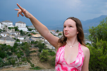 Gjirokastra attractions of Albania Thunder Sky Traveling to Albania watching the sights surprised young woman delighted with what is happening around