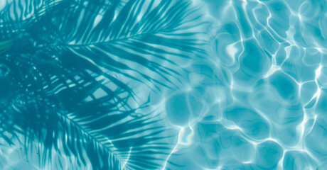Aqua waves and coconut palm shadow on blue background. Water pool texture top view.Tropical summer mockup design. Luxury travel holiday.