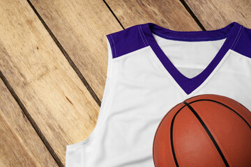 Basketball uniform on wooden background top view