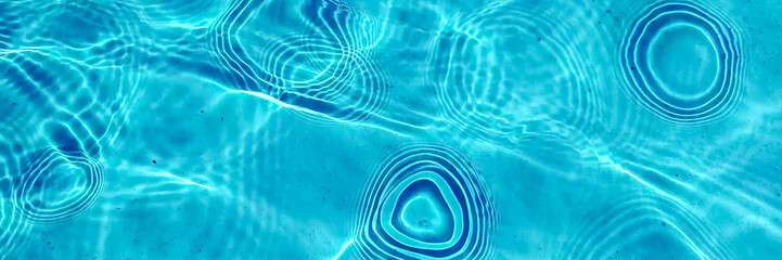Crystal clear turquoise swimming pool water texture, ideal for summer and vacation themes, with a...