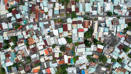 Aerial view of a urban street separating two rows of residential buildings, illustrating urban...