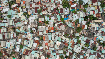 Aerial view of a symmetrical urban street separating two rows of residential buildings,...