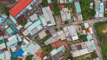 Aerial view of a symmetrical urban street separating two rows of residential buildings, illustrating urban planning and real estate concepts