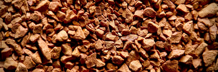 Close-up of instant coffee granules texture, ideal for food and beverage industry themes and International Coffee Day promotions