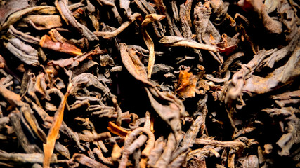 Close-up of dried loose-leaf tea, ideal for culinary themes, health and wellness content, and cultural celebrations like Chinese New Year