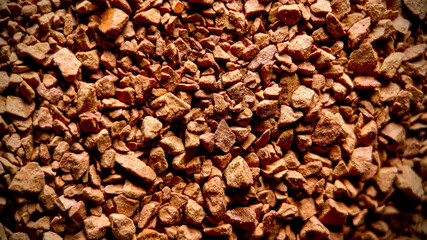 Close-up of instant coffee granules texture, ideal for food and beverage industry themes and International Coffee Day promotions