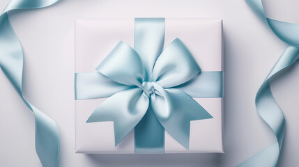 ギフトシーンのプレゼント包装に白と水色のリボンが結ばれたエレガントでシンプルおしゃれなギフトボックス