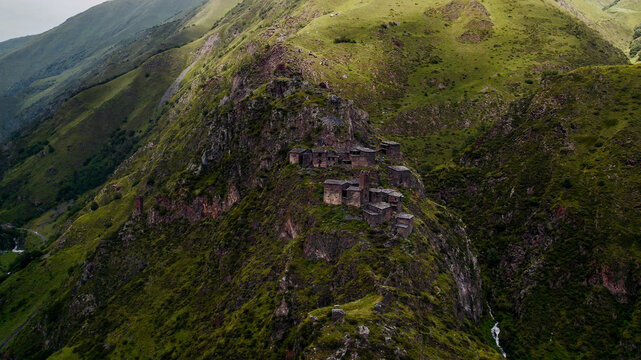 Ancient mountain monastery in verdant landscape, exemplifying historical architecture and religious heritage, ideal for cultural exploration and spirituality-themed content