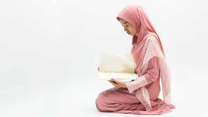 asian young beautiful muslim woman prayer dress hijab pray meditation in mosque for eid mubarak...