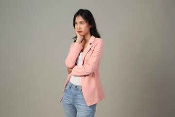 pensive asian woman wearing formal casual outfit on isolated background