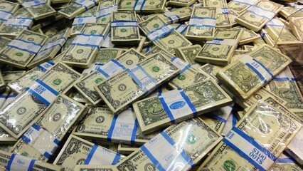 Fototapeta premium Pile of many 100 USD banknotes bills wrapped in currency straps