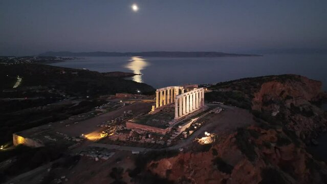 Aerial of the Temple of Poseidon in the evening on Cape Sounion, Greece.
