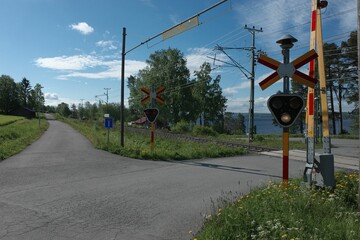 Closeup of Level crossing with a blue sky background