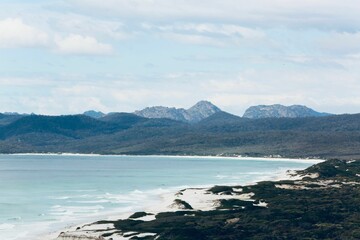 Landscape view of the beach with hills in the background