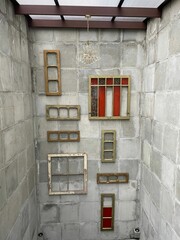 Vertical shot of different frames and borders on a wall
