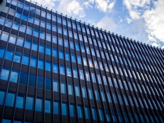 Exterior of a beautiful modern building with glass windows in Berlin, Germany