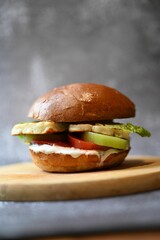 Shallow focus of a burger with Halloumi cheese and veggies