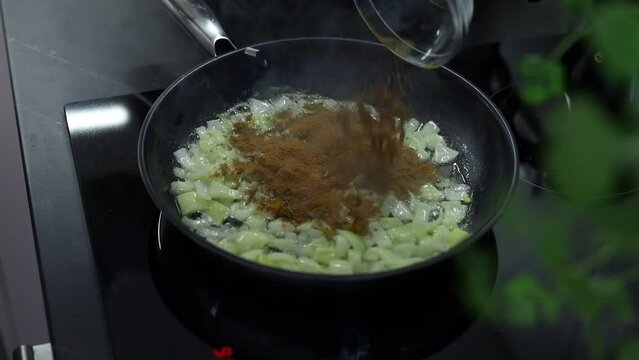 frying pan with vegetables and spaces sause