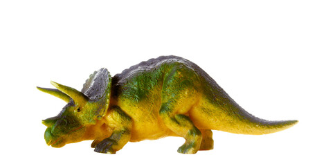 Detailed triceratops figurine isolated on a white background with visible textures