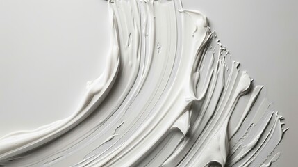 Top view of an open jar of luxurious white face cream with textures swirls and strokes on a white background