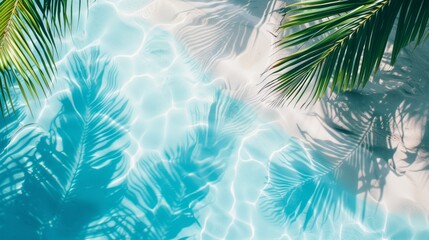 An azure seashore with clear sea water and sand and shade under the leaves of palm trees. Summer