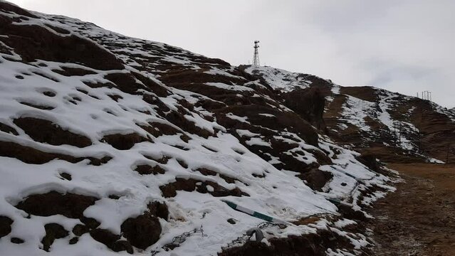 Snow patches on a hilly landscape