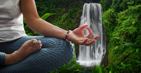 Woman in meditation position in nature