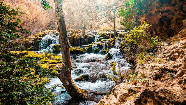 Cascade of Light and Color: The Majesty of Pitarque River Source in Fortanete, Teruel, Where Spring Awakens Nature in All its Splendor.
