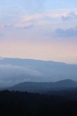 hills with some fog in cloudy evening