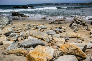 View of the rocky beach and sea. Zicatela, Oaxaca, Mexico.