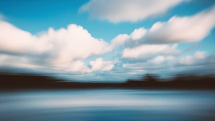 Obraz premium Blurred background. Blue sky and white fluffy clouds