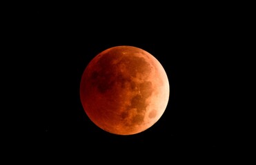 Fototapeta premium Blood moon isolated on black background