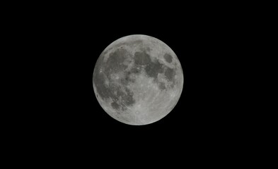 Naklejka premium Full moon against a black sky